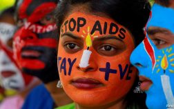 Students with their faces painted with messages pose during an HIV/AIDS awareness campaign to mark the International AIDS Candlelight Memorial, in Chandigarh, India, May 20, 2018. REUTERS/Ajay Verma - RC1254713E10